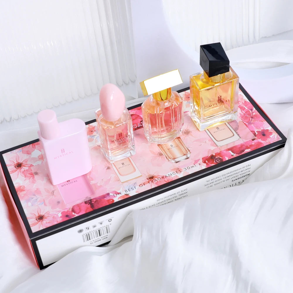 Coffret Découverte : flacons parfum sur plateau fleuri, bouchons roses et dorés