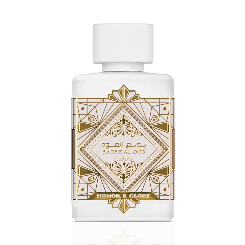 Bouteille de parfum oriental blanche à décor doré, capuchon blanc