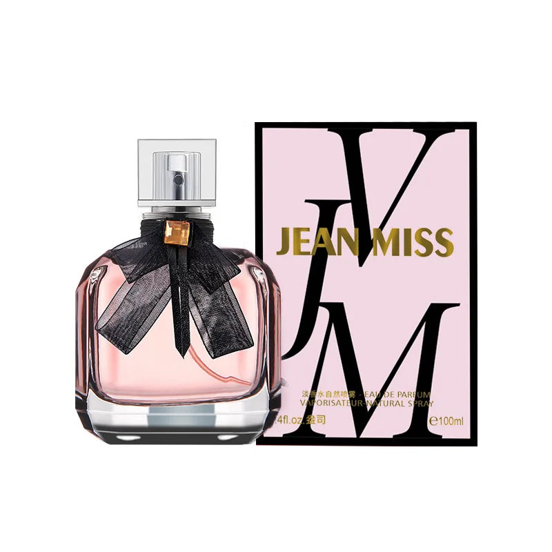 Flacon de parfum Reverse Paris pour femmes 100 ml, ruban noir, avec étui rose et couvercle argenté.