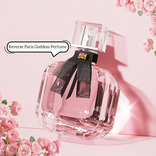 Parfum pour femmes Reverse Paris, vaporisateur en verre rosé avec ruban noir et capuchon argenté.