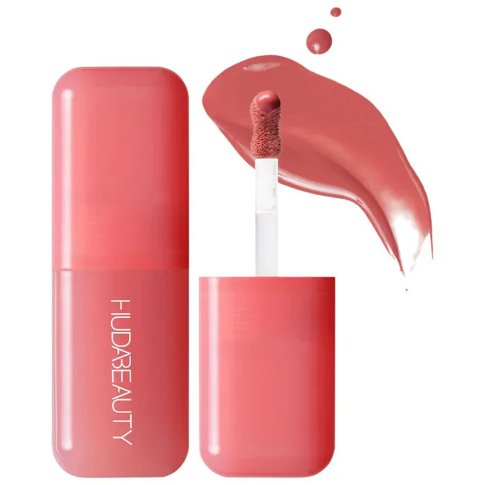 Blush liquide Huda Beauty en flacon transparent, teinte rose cuivré avec applicateur