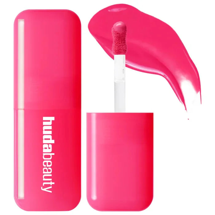 Blush liquide Huda Beauty en flacon transparent, teinte fuchsia avec embout applicateur